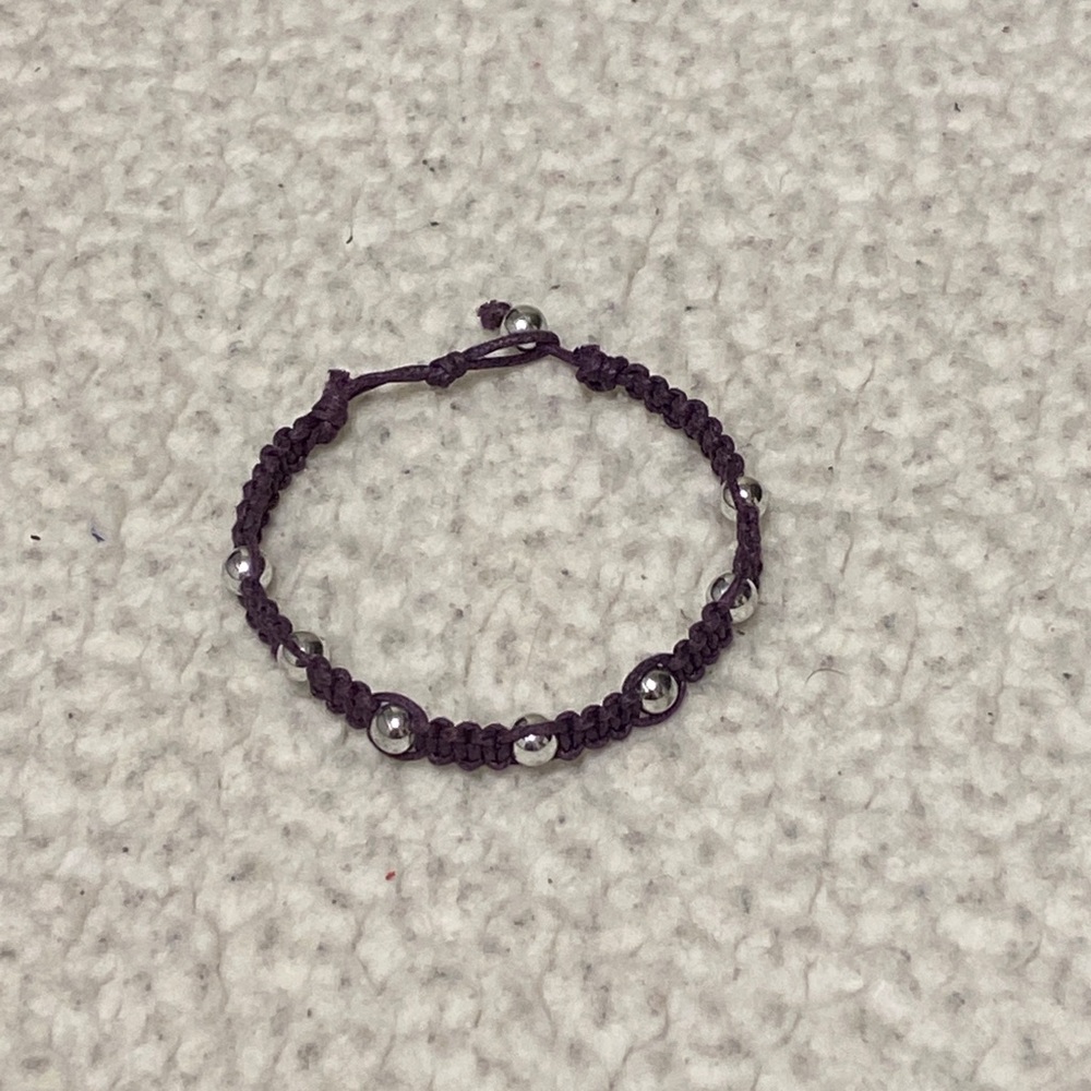 Purple beaded bracelet with silver beads